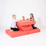 Universelles Kindersofa von monboxy in Koralle - Kletterling – einfach Kind sein